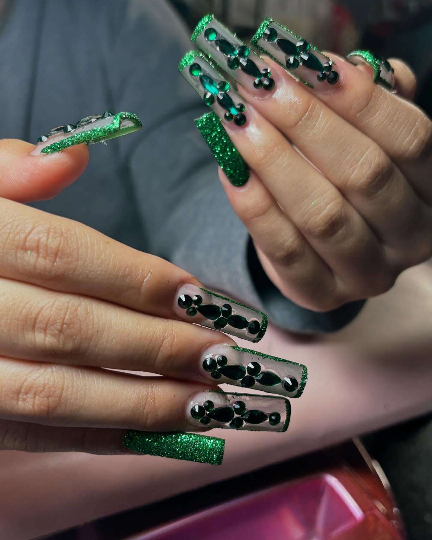 Emerald green rhinestone nail art