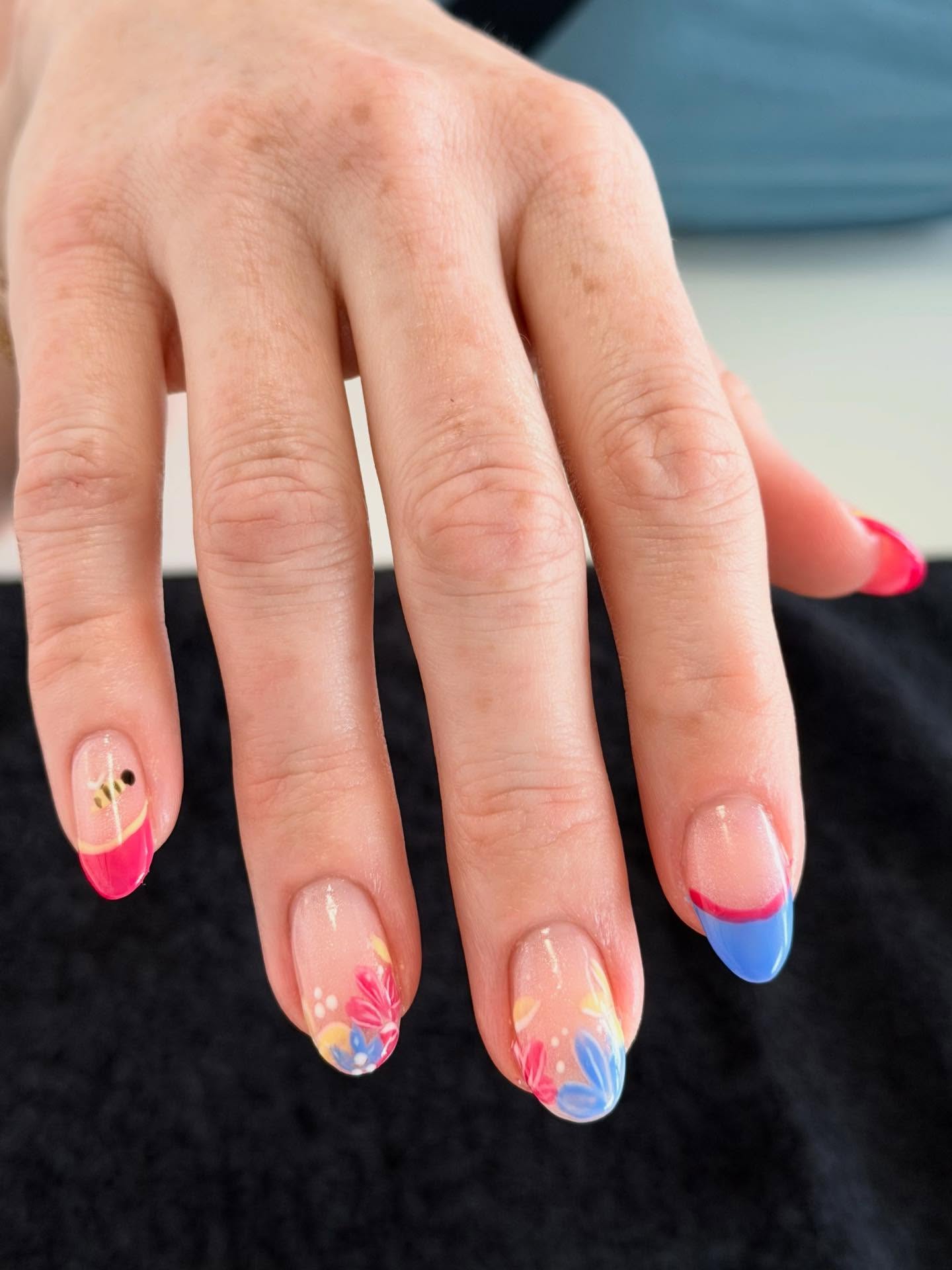 Pink and blue hand-painted floral nail art