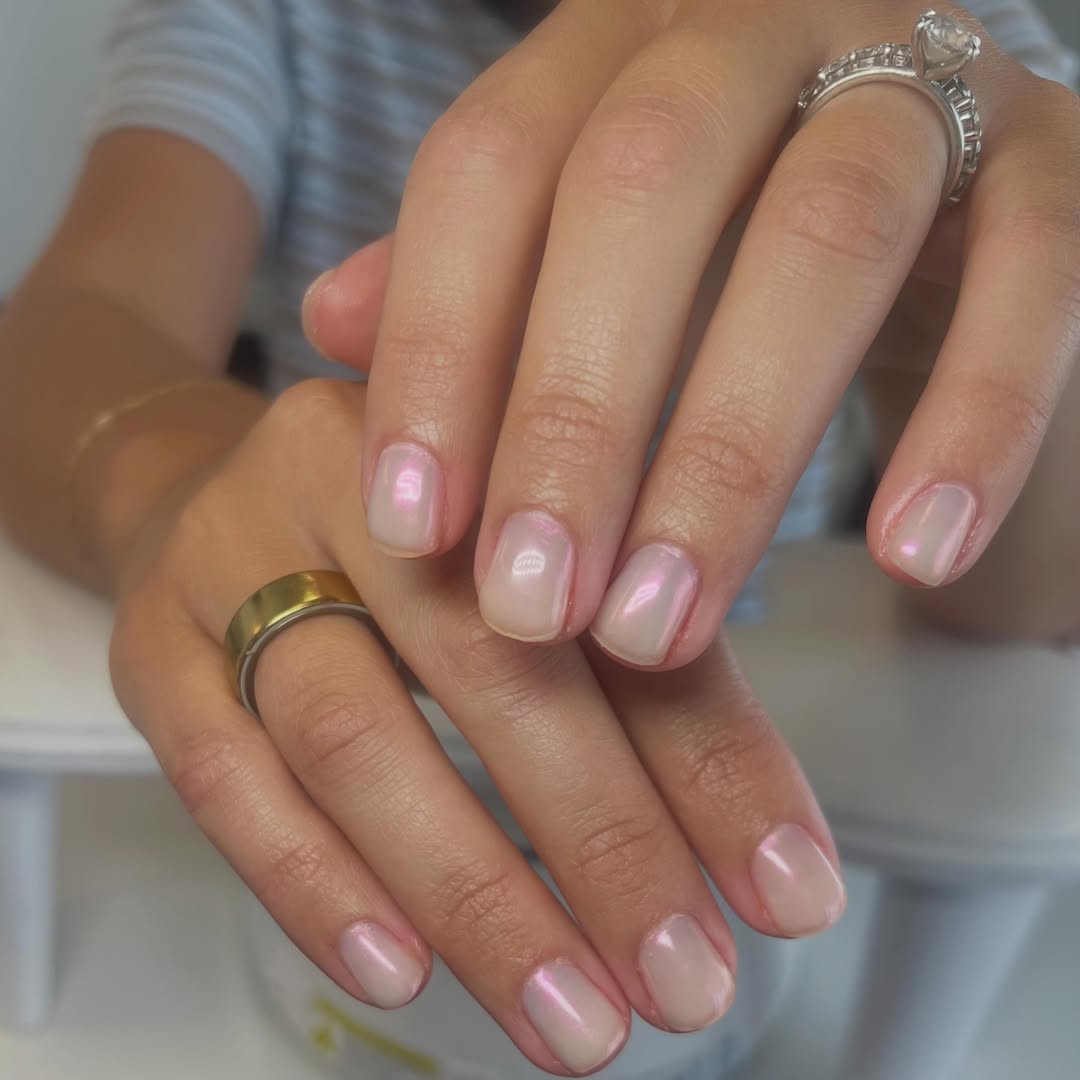 Glazed, iridescent pink natural nail finish